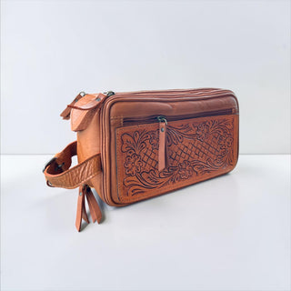 Tan tooled leather toiletry bag