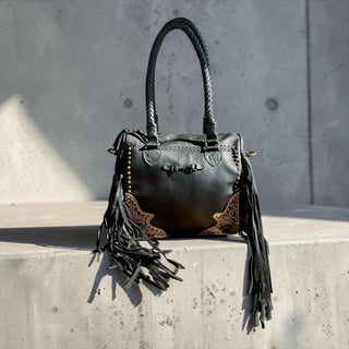 Black fringe leather handbag