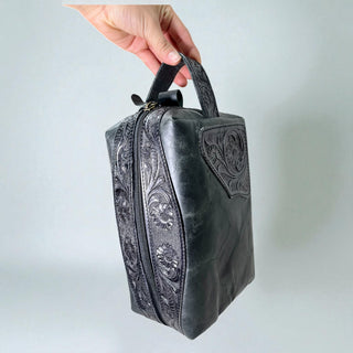 Black tooled leather toiletry bag