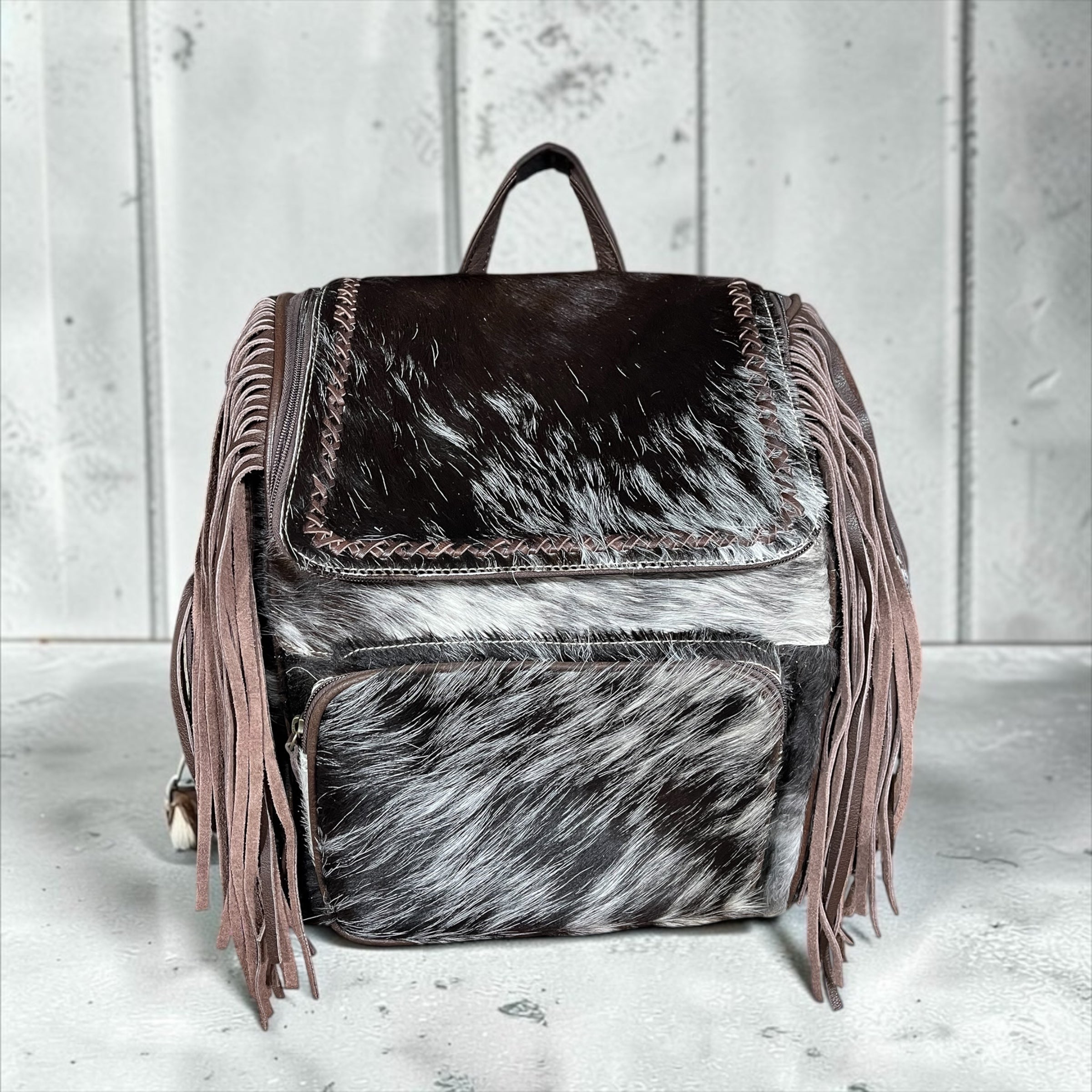 All cowhide fringe backpack