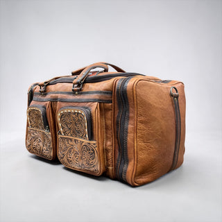 Floral tooled leather rolling duffle bag