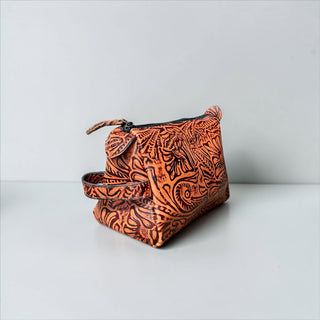 Orange floral embossed leather makeup bag