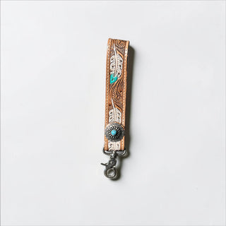 Feather tooled leather wristlet