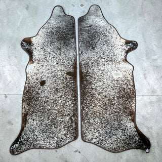 Brown border matching sets 6-7’ cowhide rug