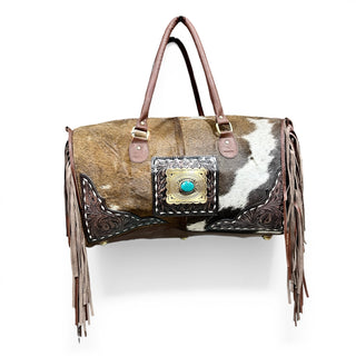 Brown tooled leather & cowhide fringe duffle bag