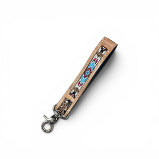 Withe Aztec tooled leather wristlet strap
