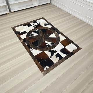 Star cowhide patchwork rug 4x6’