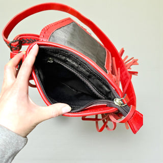 Red bucking fringe crossbody bag