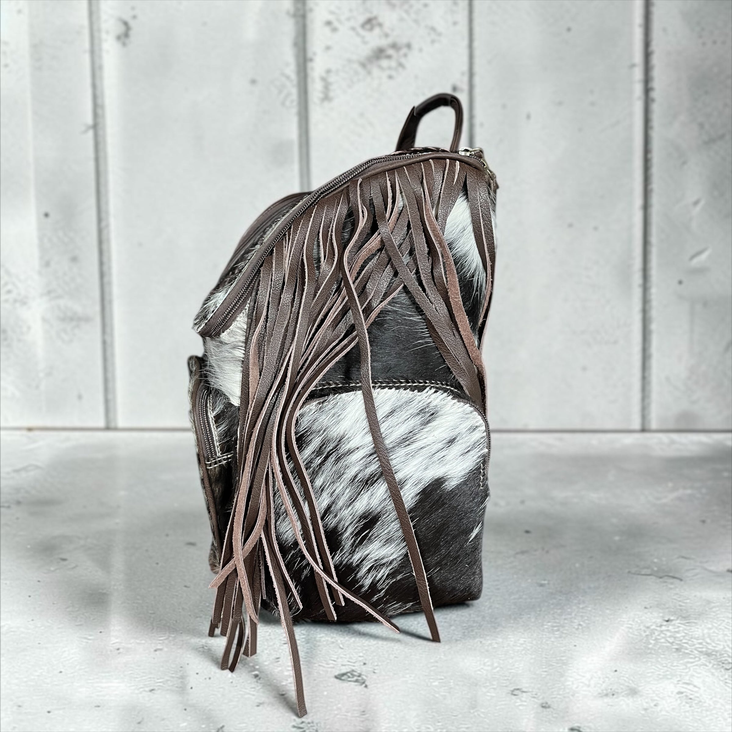 All cowhide fringe backpack