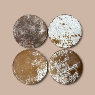All tan cowhide round placemats- set of 4