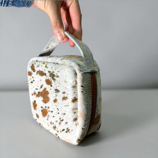 Gold acid wash cowhide makeup bag