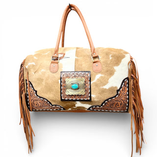 Tan tooled leather & cowhide duffle bag