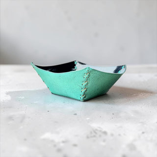 Turquoise tooled leather & cowhide bowl
