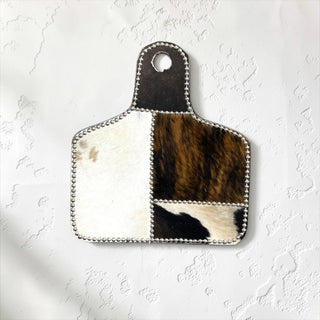 Silver cow tag cowhide wall decor