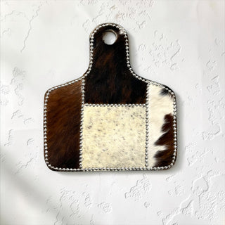 Silver cow tag cowhide wall decor