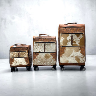 Tan tooled leather & cowhide luggage