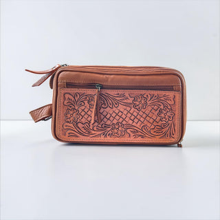 Tan tooled leather toiletry bag