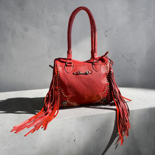 Red fringe leather handbag