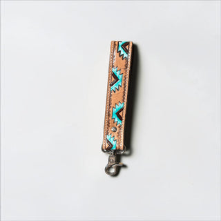 Aztec tooled leather wristlet