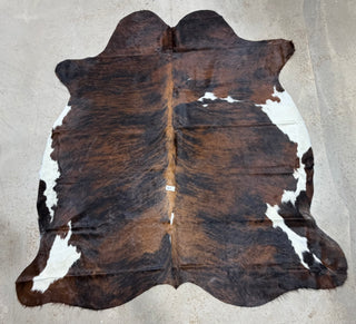 6.9’x6.3’ Brazilian cowhide rug (A12)