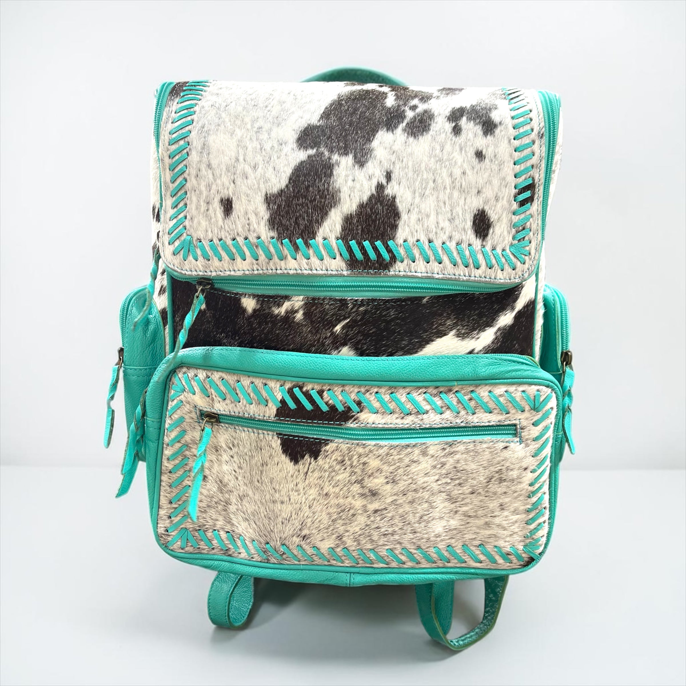 cowskin leather backpack The Desperado Cowhide or attach the leather shoulder strap for an easy over Mini Cowhide Turquoise Leather Backpack/Bum