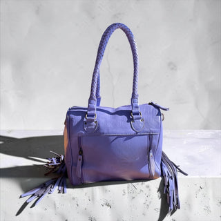 Purple fringe leather handbag