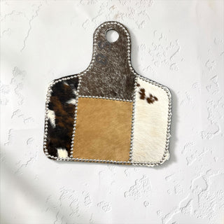 Silver cow tag cowhide wall decor