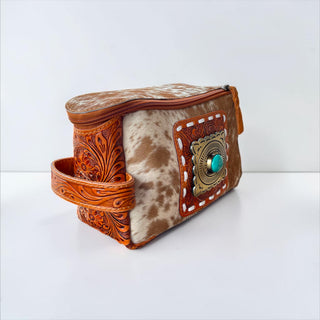 Tan tooled leather & cowhide buckle makeup bag