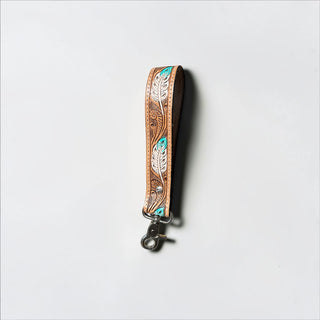 Feather tooled leather wristlet