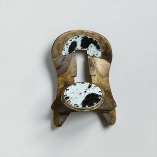 Black/white cowhide wood saddle decor