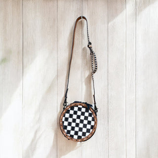 Checker tooled leather round crossbody bag