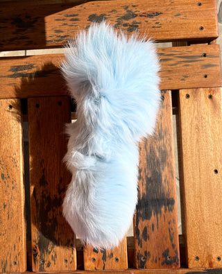 Solid dyed light blue fox tail