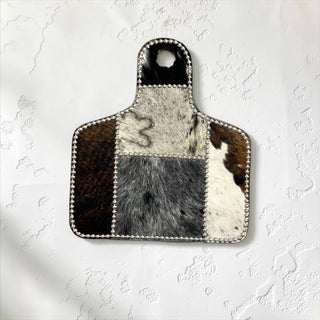 Silver cow tag cowhide wall decor