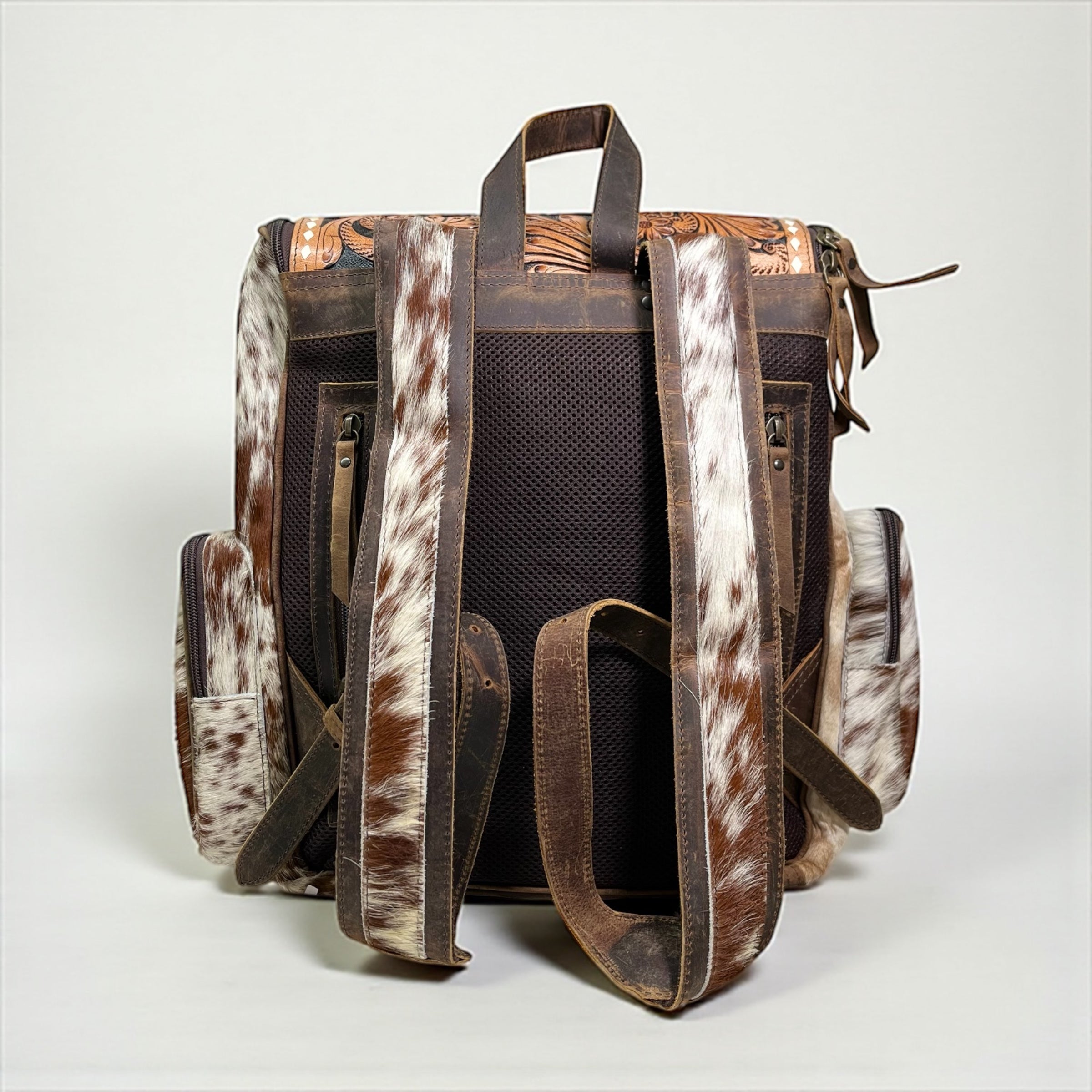 cowhide leather sierra backpack Deer tooled leather & cowhide backpack