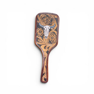 Skull tooled leather hairbrush