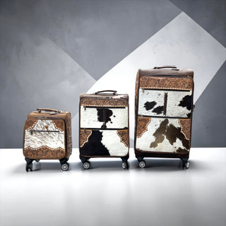 Brown tooled leather & cowhide luggage