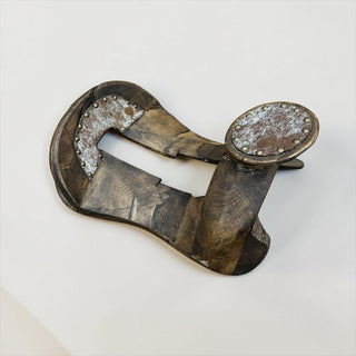 Tan cowhide wood saddle decor