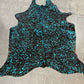 Dyed turquoise on black cowhide