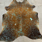 Dyed turquoise on brown cowhide